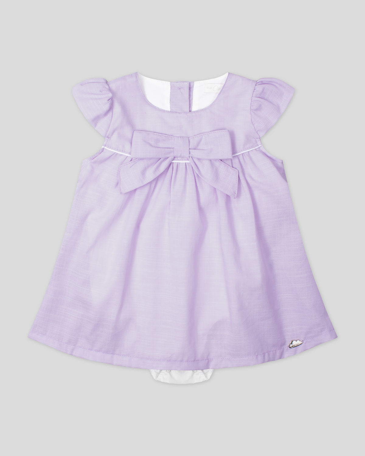 Vestido body en lino lila con moño y botones en espalda para bebé niña