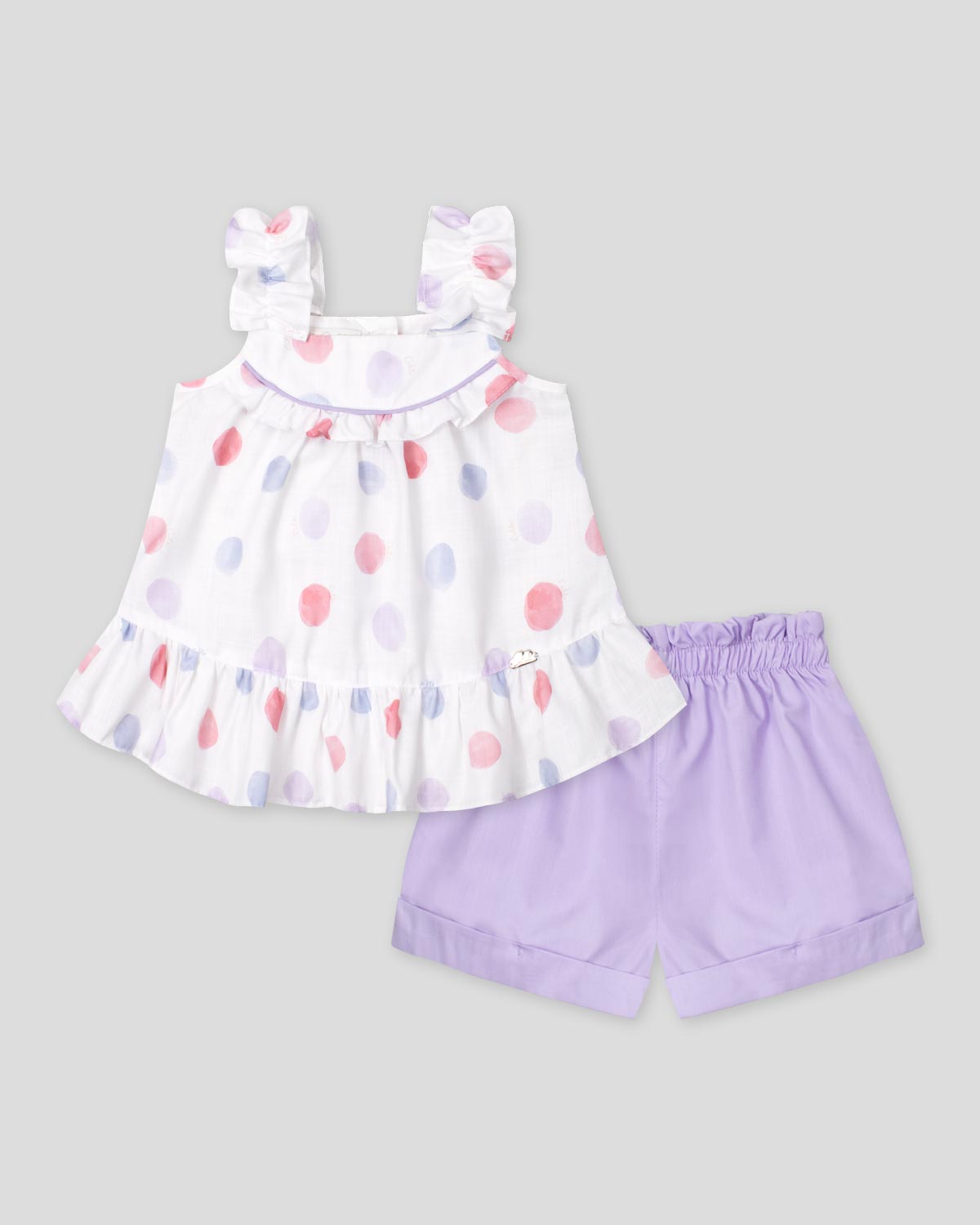 Conjunto blusa  en lino de tiras zurcidas estampada con lunares y short lila para niña